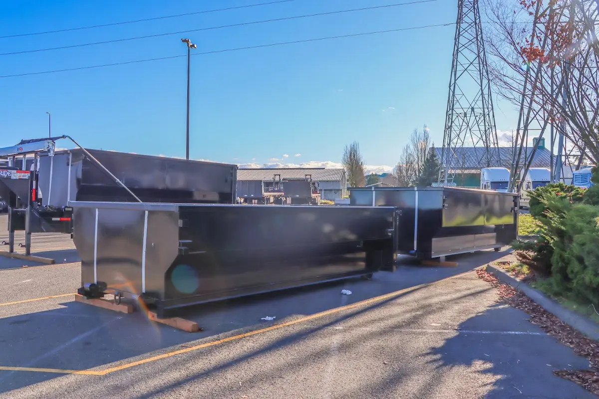 Roll-off dumpster ready for waste disposal at job site for 3 Yard Dumpster Rental in Lamont
